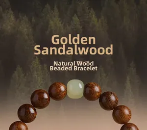 Macro detail of natural golden sandalwood beads with fine wood grain and white accent stone