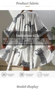 Detail showing white imitation silk robe with black leopard print and washing instructions