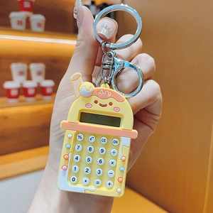 Detailed view of bubble tea calculator keychain with functional numeric keypad and orange silicone