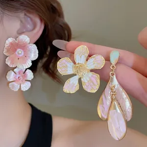 Elegant floral heart stud earrings with pink enamel finish and pearl details for women
