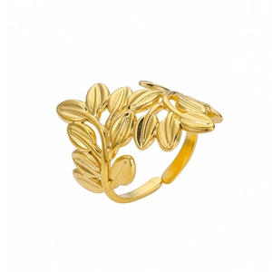 Detailed close-up of a golden leaf-shaped ring with adjustable open band and polished texture