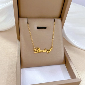 Minimalist titanium steel gold necklace with Darling script pendant in jewelry box