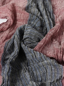 Macro shot of navy and burgundy pinstripe scarf showing pleated texture and fabric detail
