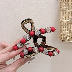 Elegant large camellia hair claw clip with red beads and pearls for thick hair styling