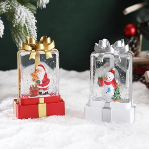Christmas LED light-up gift box snow globes featuring Santa and snowman holiday decor