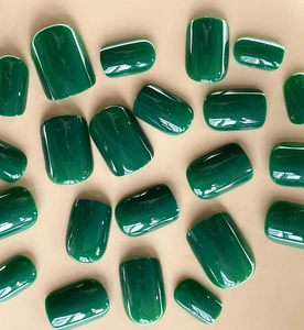 Short round square emerald green press-on nails with a glossy high-shine finish
