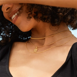 Three-layer gold chain necklace set for women featuring a textured rectangular pendant