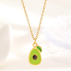 Macro view of gold chain necklace featuring a colorful avocado fruit oil drop pendant