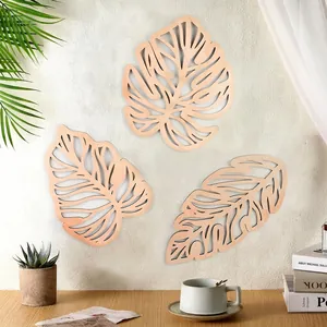 Three-piece wooden palm leaf wall decor set for living room shown in a cozy home setting