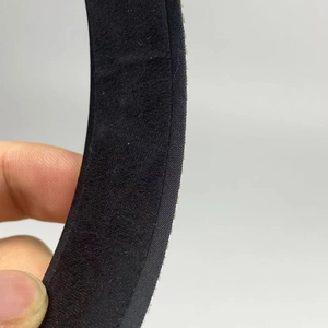 Detail shot of the black non-slip velvet lining and fine twill edge on the luxury headband
