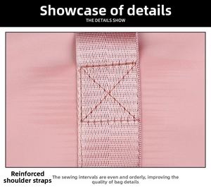 Detailed macro view of reinforced X-box stitching on a pink nylon travel bag strap