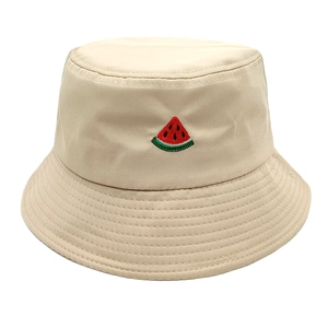 Close-up of fine watermelon embroidery on a beige cotton bucket hat with parallel stitching