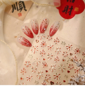 Detail of red fireworks and heart pattern nail stickers with festive Chinese charms