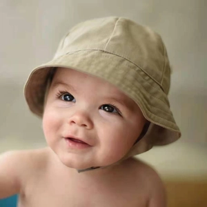 Detail of khaki cotton baby sun hat with adjustable chin strap for sun protection