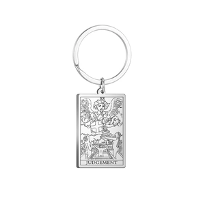 Macro shot of the Tarot Judgement card stainless steel keychain showing engraved details