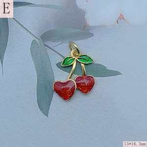 Detailed view of red heart cherry pendant with green leaves and 13x16.3mm dimensions