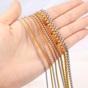 Gold and silver stainless steel box chains in various thicknesses shown in hand