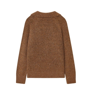 Detail of dark brown chunky knit sweater with ribbed high neck and dropped shoulders