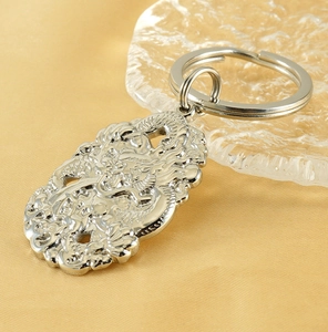 Detailed relief of a traditional Chinese dragon on a stainless steel keychain
