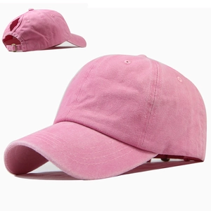 Detailed view of pink cotton ponytail baseball cap featuring back hole and metal buckle