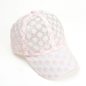 Close-up of intricate pink floral embroidery and delicate lace mesh on a baseball cap