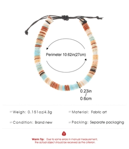 Detail of adjustable Bohemian woven bracelet with colorful disc-shaped fabric beads