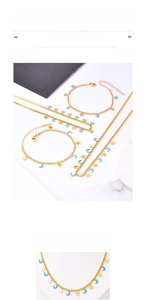 Detail view of titanium steel star and moon necklaces with blue enamel in gold finish
