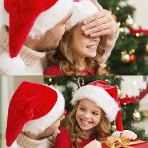 Close-up of thick plush red and white Christmas hats worn in a cozy festive setting