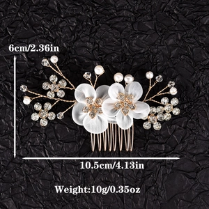 Detailed view of handmade fabric flower bridal hair comb with pearls and rhinestones