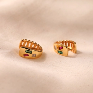 Detailed macro view of 18K gold plated hoop earrings with colorful zircon gemstones