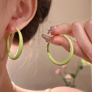 Minimalist light green enamel hoop earrings for women in a stylish summer aesthetic