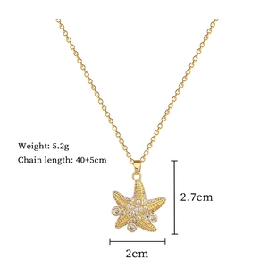 Detailed view of starfish pendant with sparkling zircon crystals and dimensions on gold chain