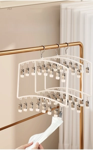 Detail of multi-clip baby sock hanger with non-slip metal clips for closet storage