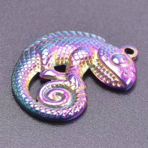 Macro view of a 18k gold plated stainless steel lizard pendant with colorful gradient scales