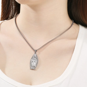 Detail view of Our Lady of Guadalupe pendant on a box chain for minimalist religious styling