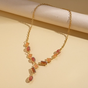 Detail showing vintage gold chain with amber geometric resin stones and rhinestones