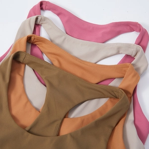 Racerback sports bra in olive, orange, beige, and rose for yoga and fitness training