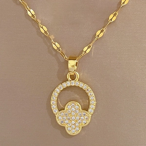 Luxurious gold titanium necklace featuring a sparkling circular clover pendant for women