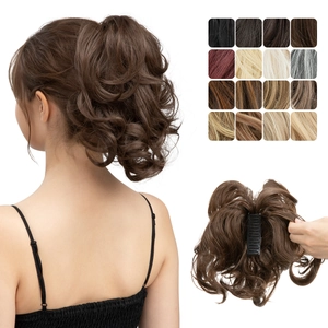 Detail of adjustable curly ponytail hairpiece with claw clip in 16 natural colors