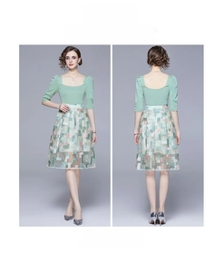 Detail of mint green puff sleeve top and geometric embroidery mesh skirt set
