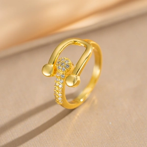 Gold plated horseshoe ring with micro-paved cubic zirconia in a minimalist U-shaped design