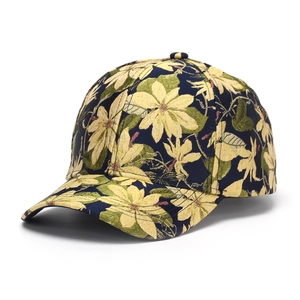 Detail of floral embroidery and jacquard texture on a navy blue vintage baseball cap