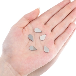 Polished stainless steel teardrop pendants for DIY jewelry making shown on hand