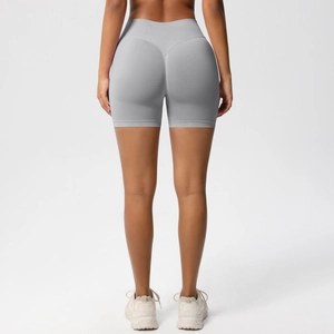 Close-up back view of gray seamless high-waisted gym shorts with peach butt lift design