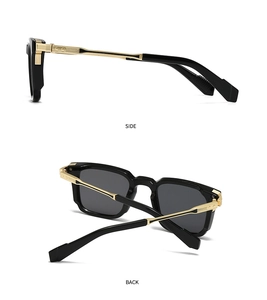 Detail view of square sunglasses featuring golden metal accents on black temples