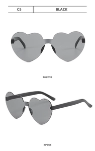 Detailed front and side view of heart-shaped rimless sunglasses in black with dark lenses