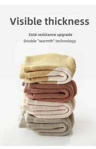 Detailed stack of thick thermal non-slip baby socks in multiple solid autumn colors