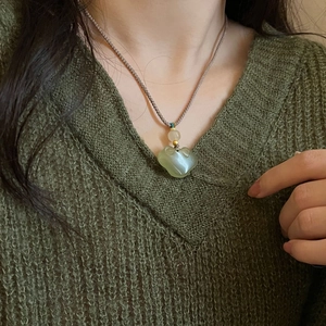 Handcrafted Ruyi lock jade pendant necklace with an adjustable brown woven cord for women
