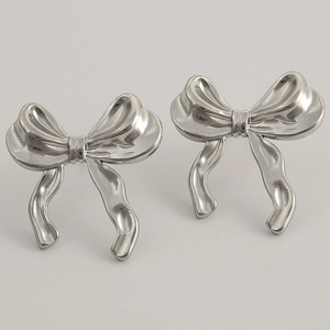 Close-up of silver-tone 304 stainless steel bow earrings with high-polish metallic finish