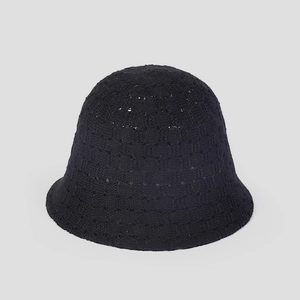 Close-up of breathable knitted black fisherman hat showing hollow texture and soft material